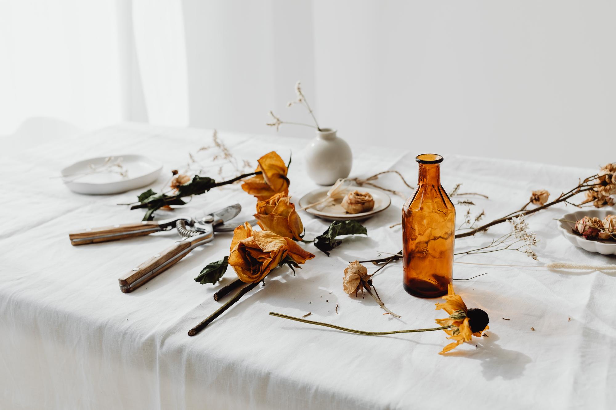Studio table laid out for a small tasting event with candles